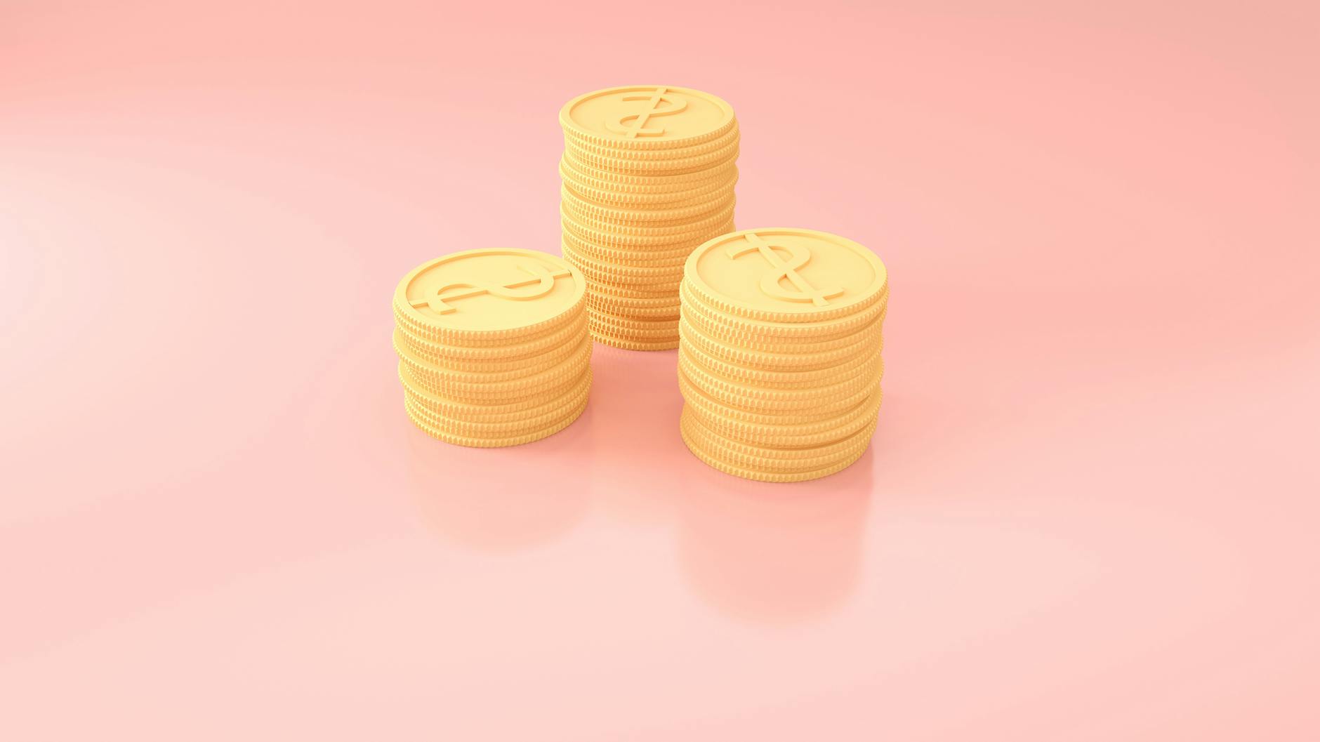 Yellow plastic coins on a pink background
