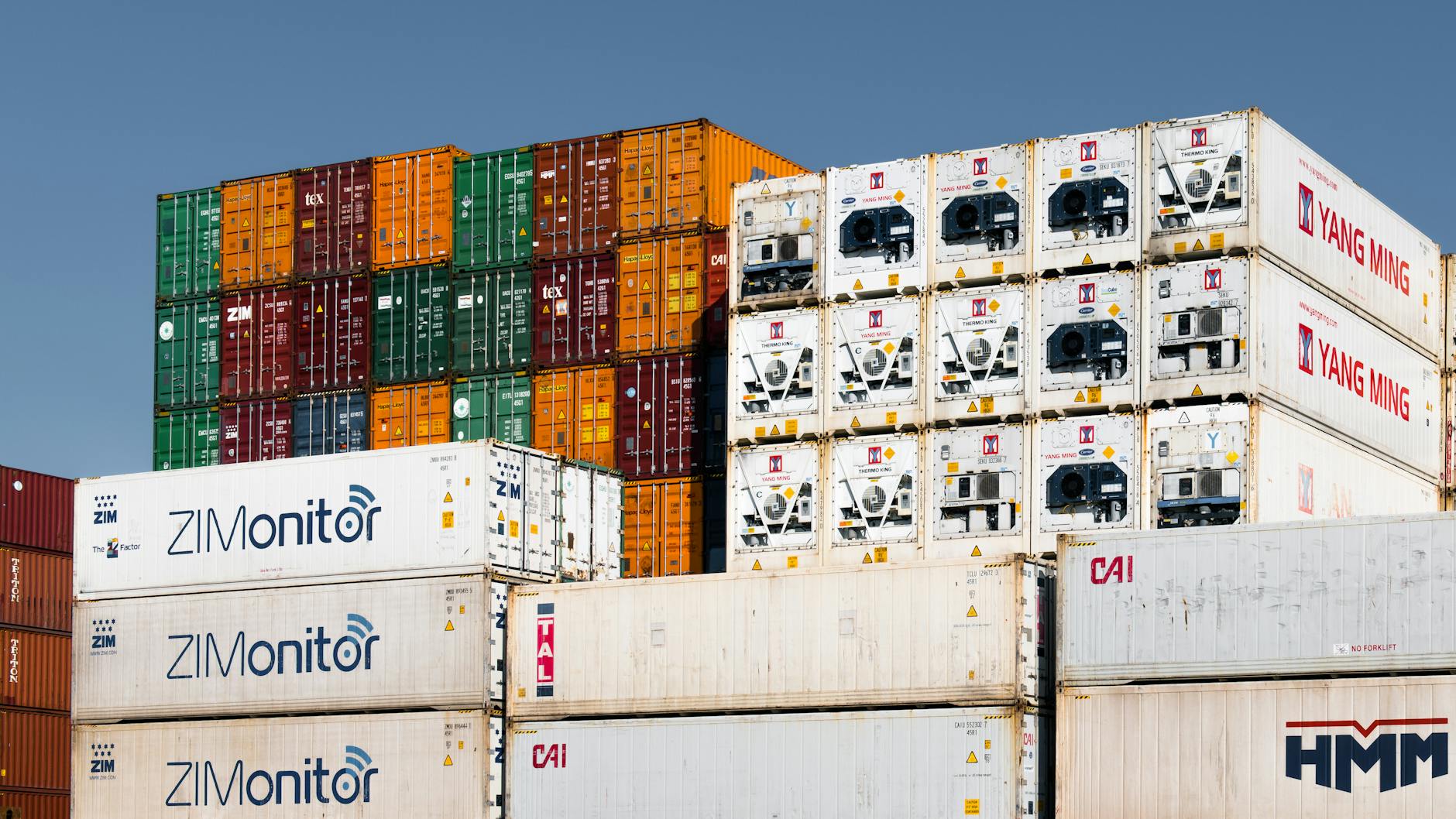 stacked shipping containers at hamburg port